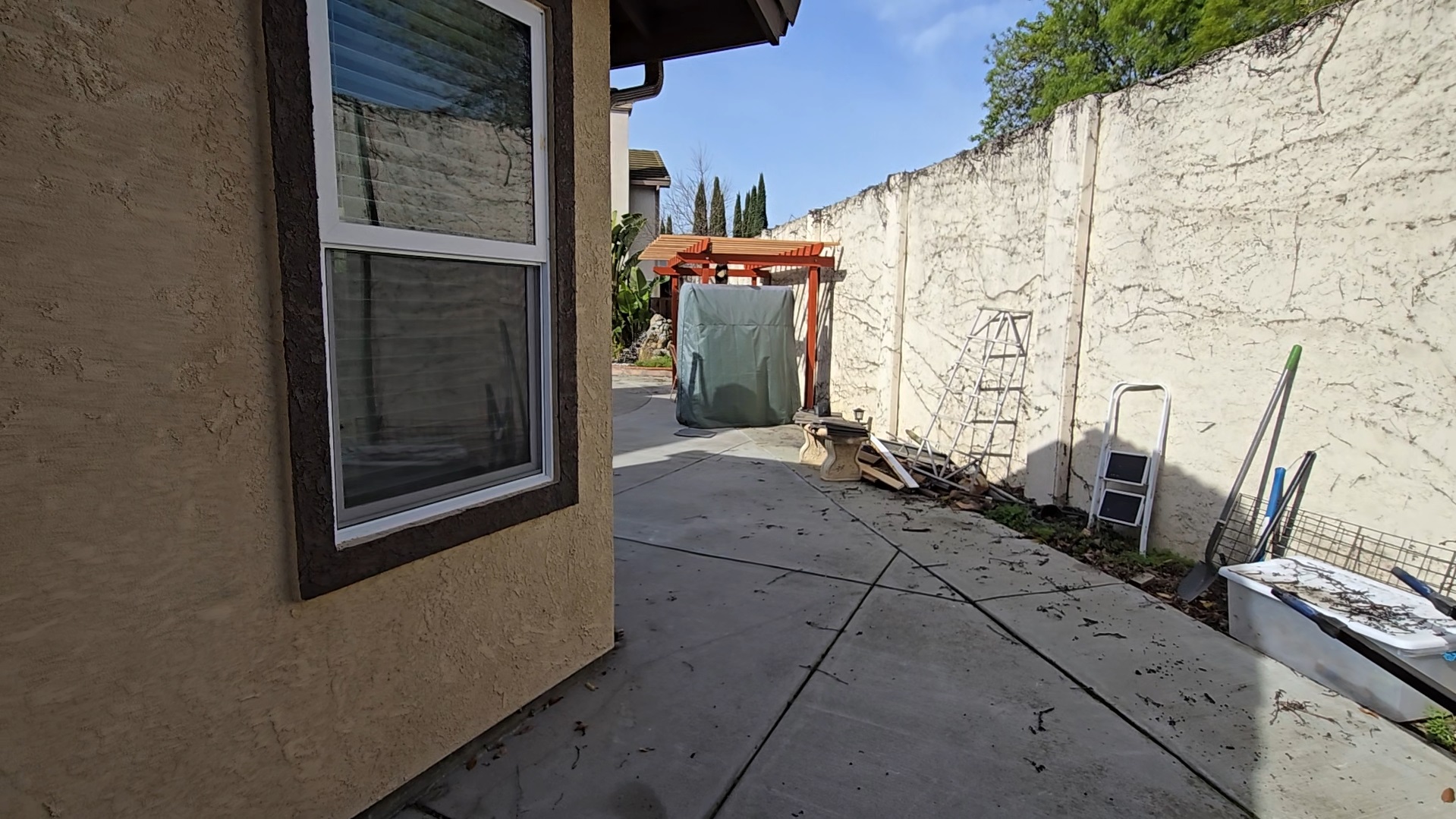 Side Yard with Tools and View Toward Pergola
