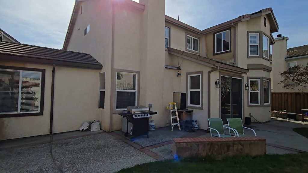 Rear View of House with Patio and BBQ Grill Rear View of House with Patio and BBQ Grill