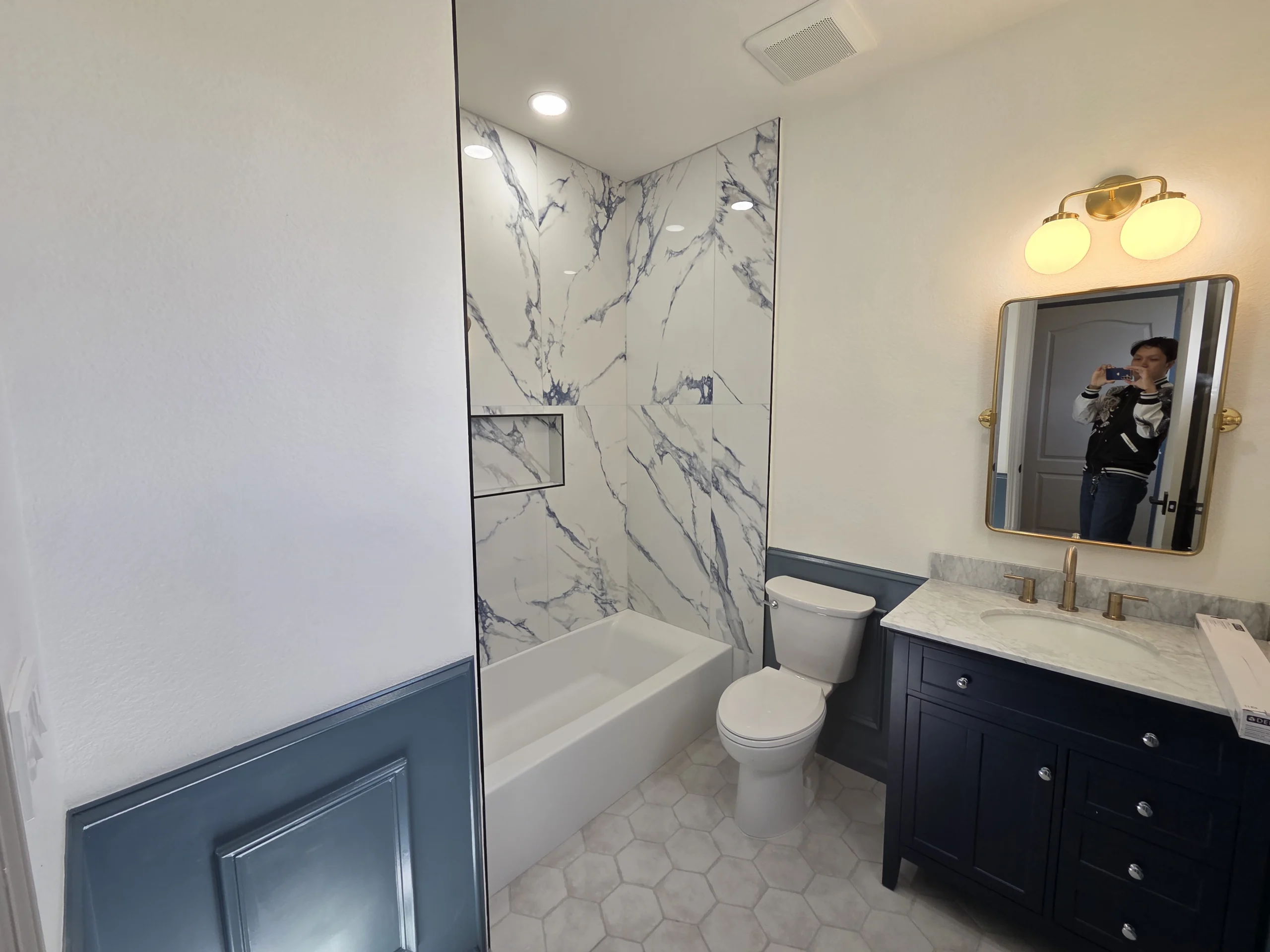 Shower with Marble Surround and Modern Fixtures