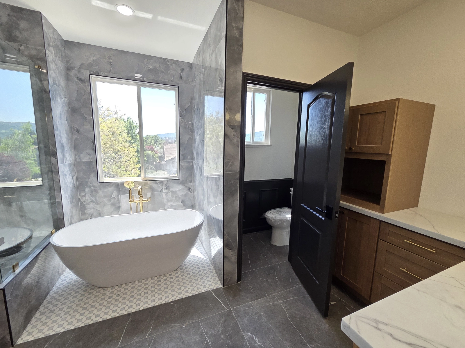 9Builders: High-End Bathroom Remodel Featuring Custom Cabinets and Marble