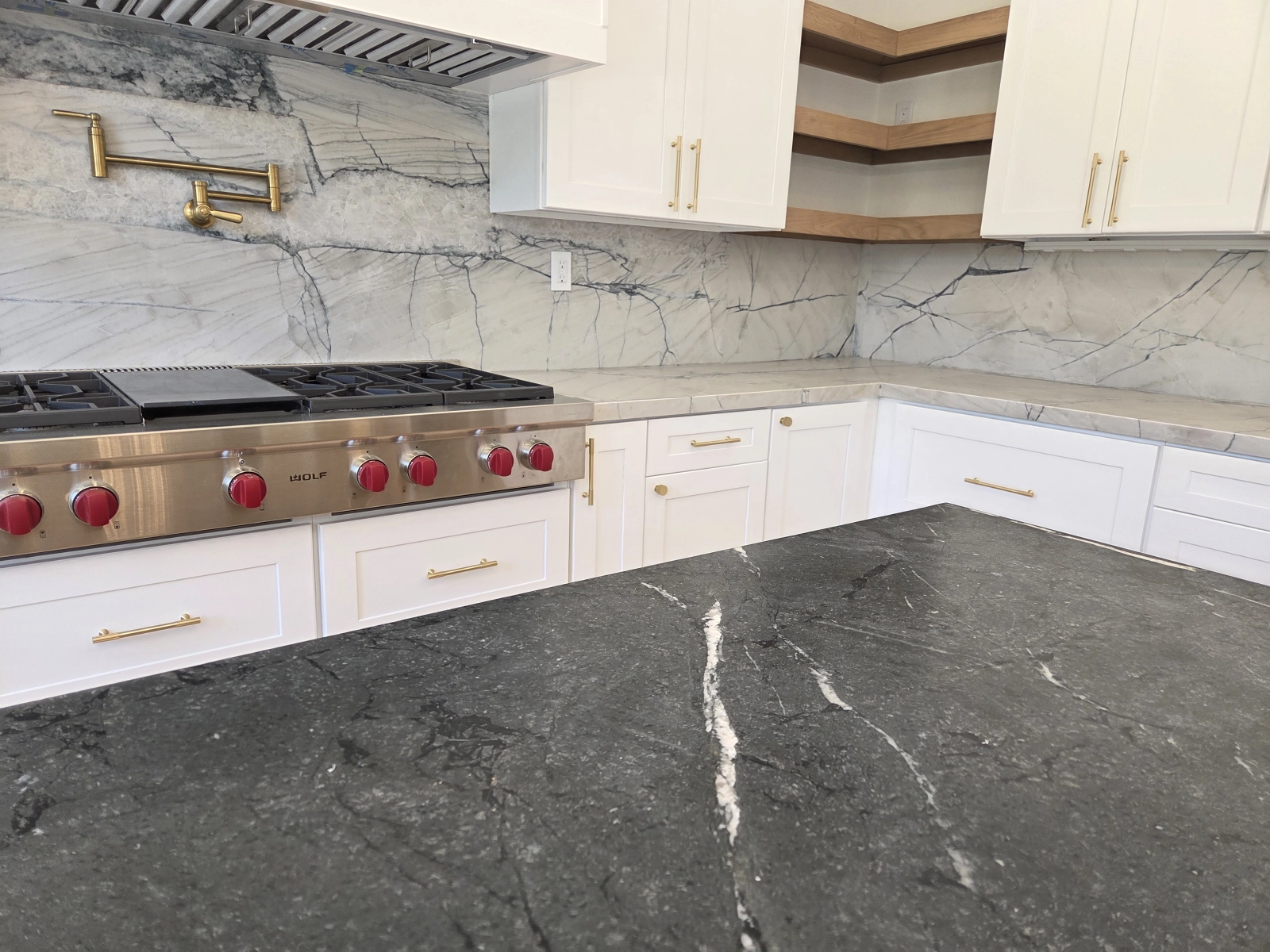 9Builders: Stunning Kitchen with Beautiful Marble Backsplash and Gold Fixtures