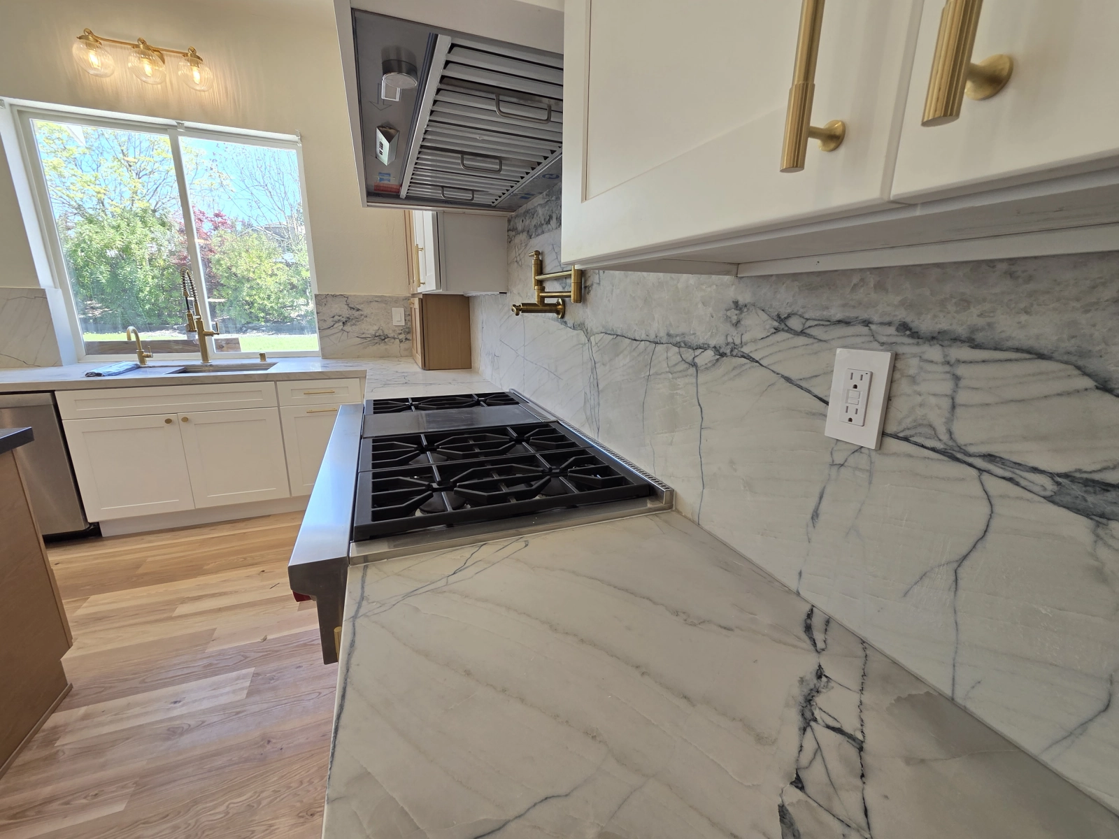 Sleek Kitchen Design with Appliances and Lighting