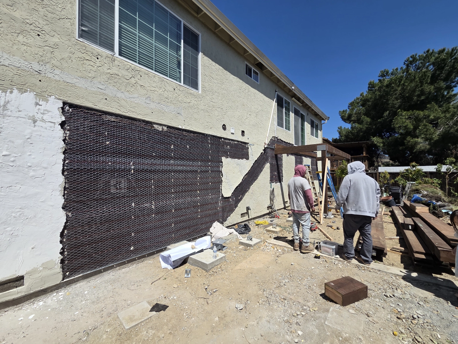 Front view of framed deck structure from backyard