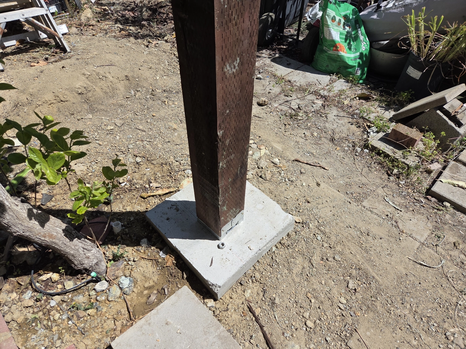Concrete footing with wood post installation