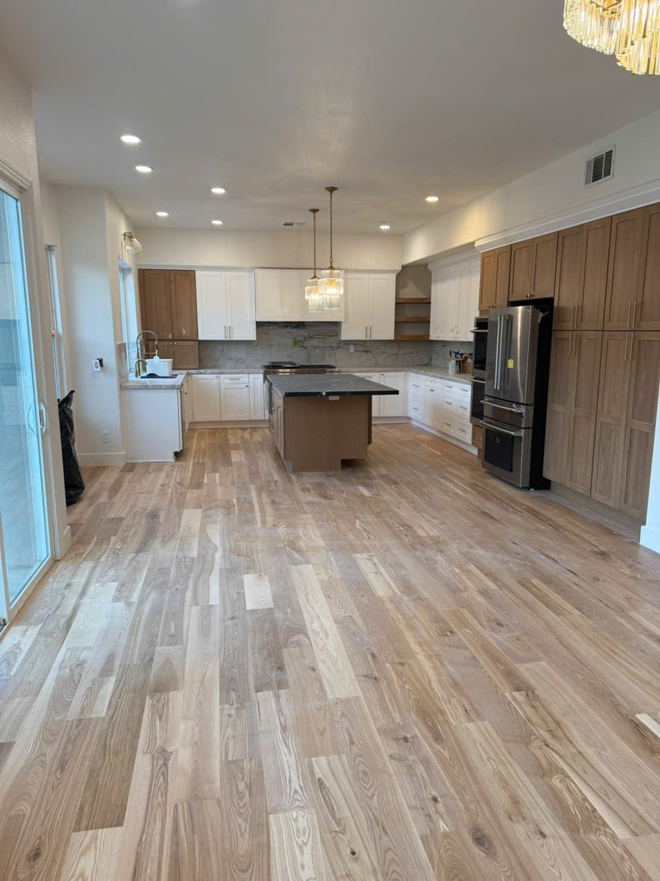 Open Kitchen with Island and Hardwood Floors