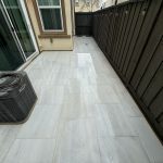 Tiled Walkway Near House with Fresh Landscaping