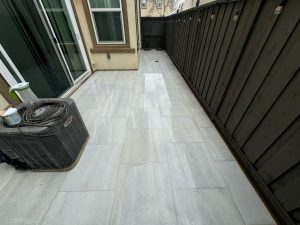 Tiled Walkway Near House with Fresh Landscaping
