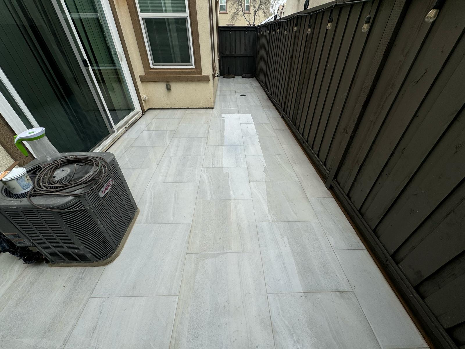 Tiled Walkway Near House with Fresh Landscaping