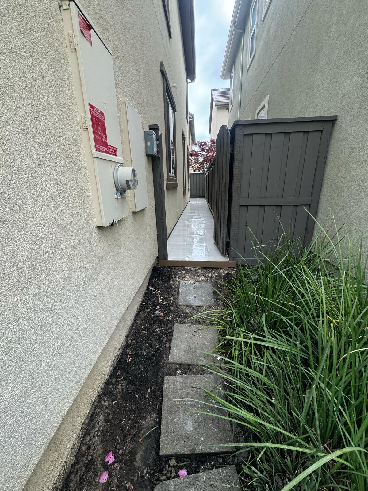 Paved Pathway Leading to Backyard Gate