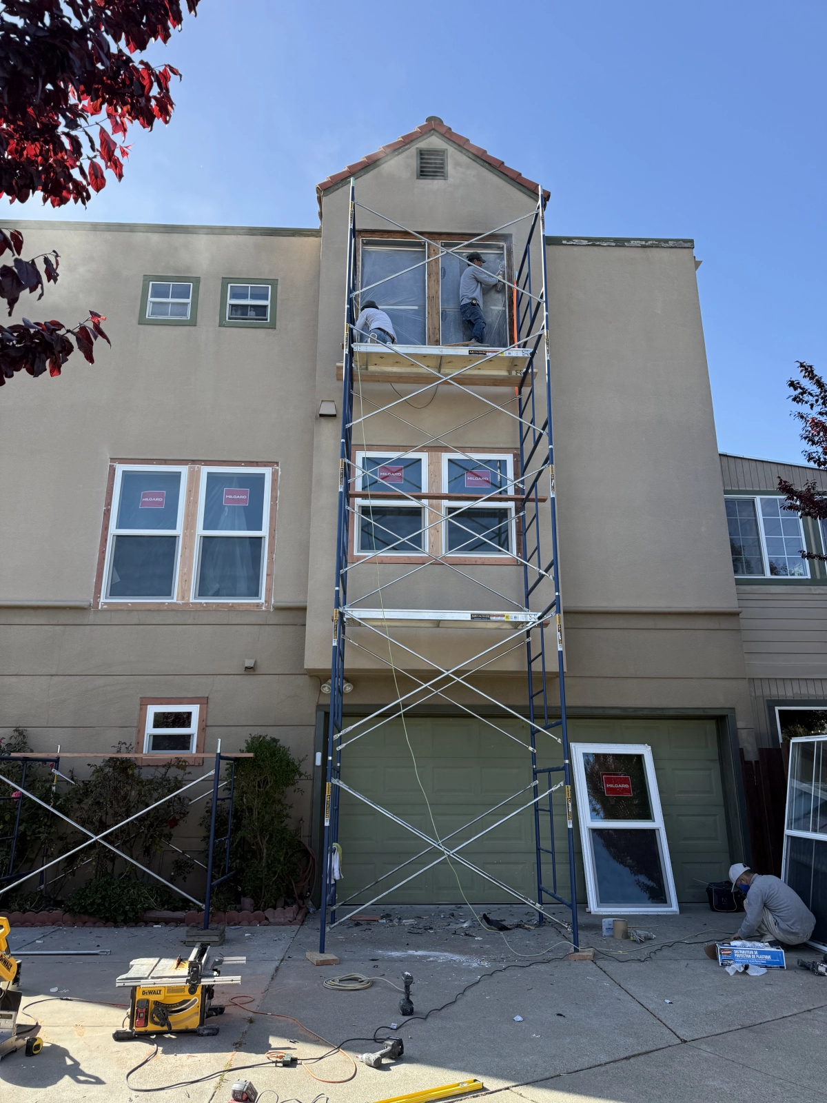 Window Installation in Progress with Scaffold Setup