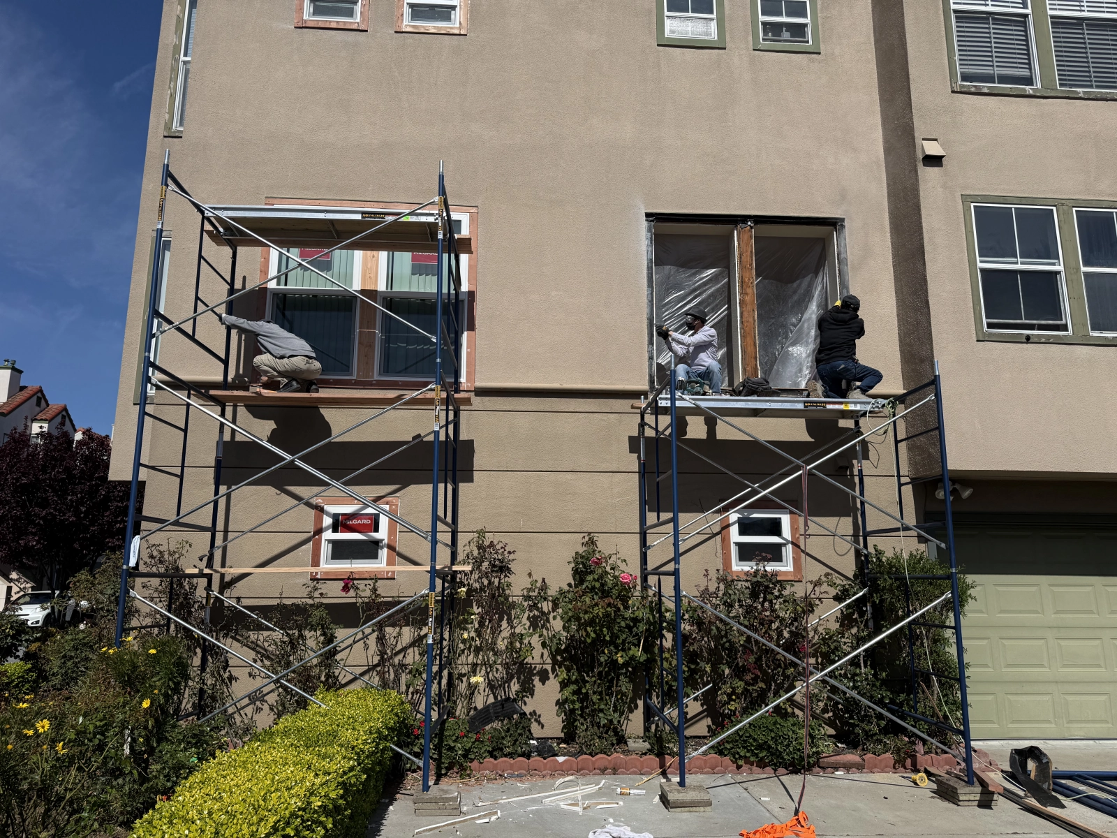 Multiple Window Replacements in Progress with Scaffold Assistance